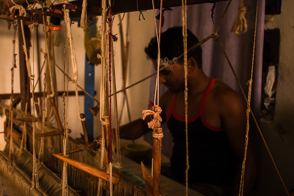 Silk weaver at a loom in Chanderi