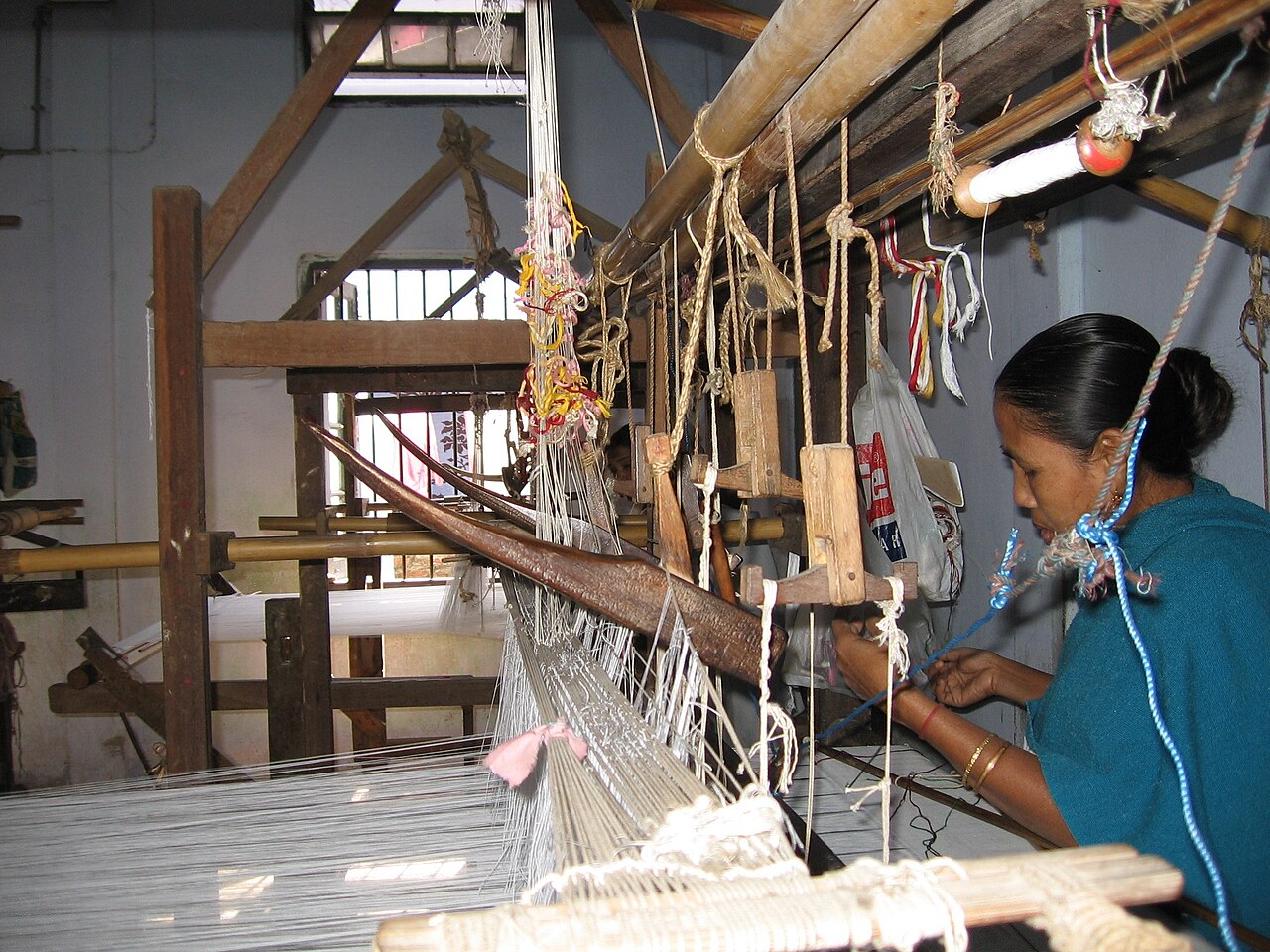 Artisan weaving on a traditional handloom